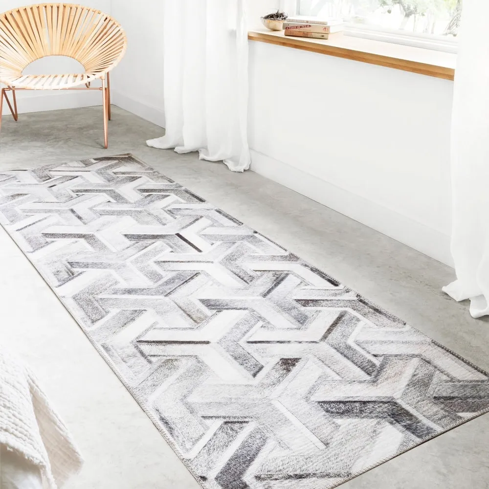 Alexander Home Davide Printed Faux Cowhide Area Rug