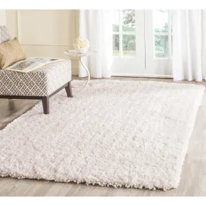 SAFAVIEH. Handmade Alannah Shag Dushka Solid Polyester Rug