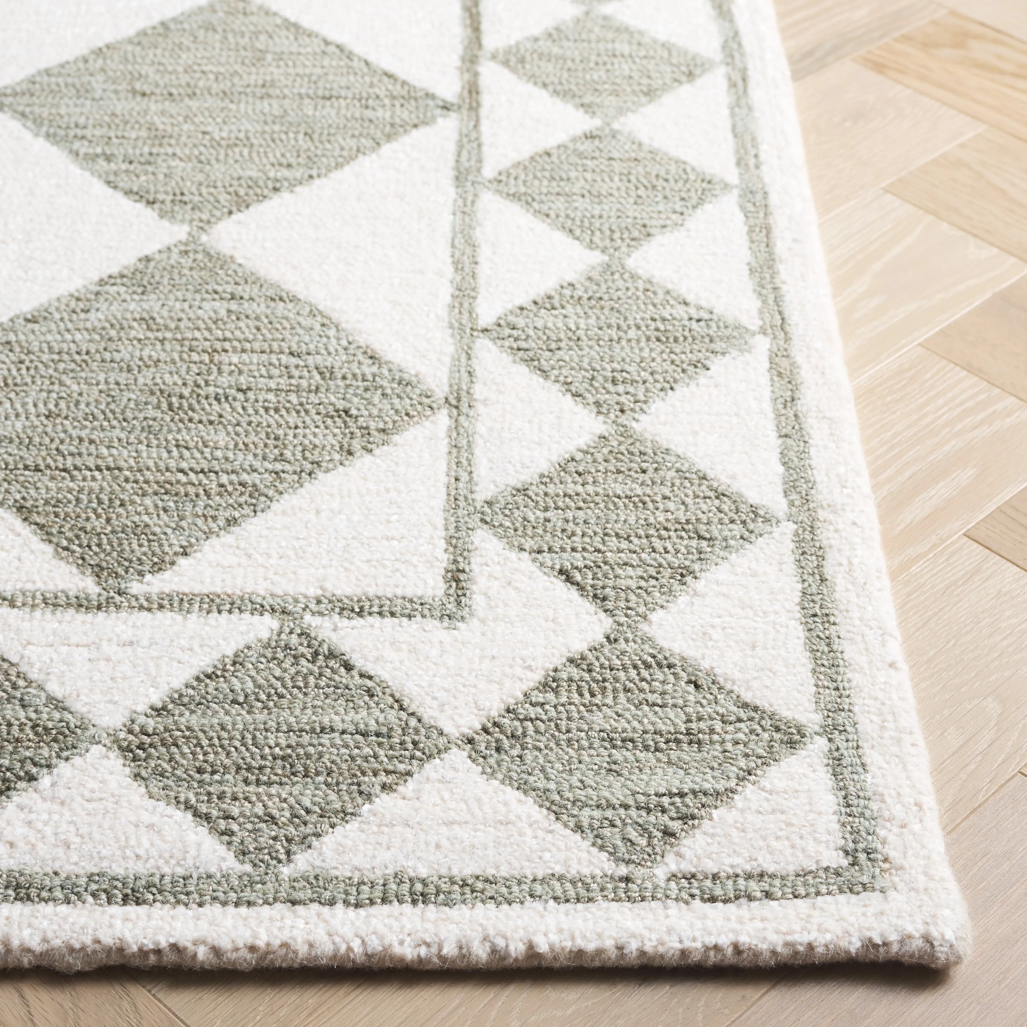 SAFAVIEH Handmade Ebony Nidia Modern & Contemporary Wool Rug