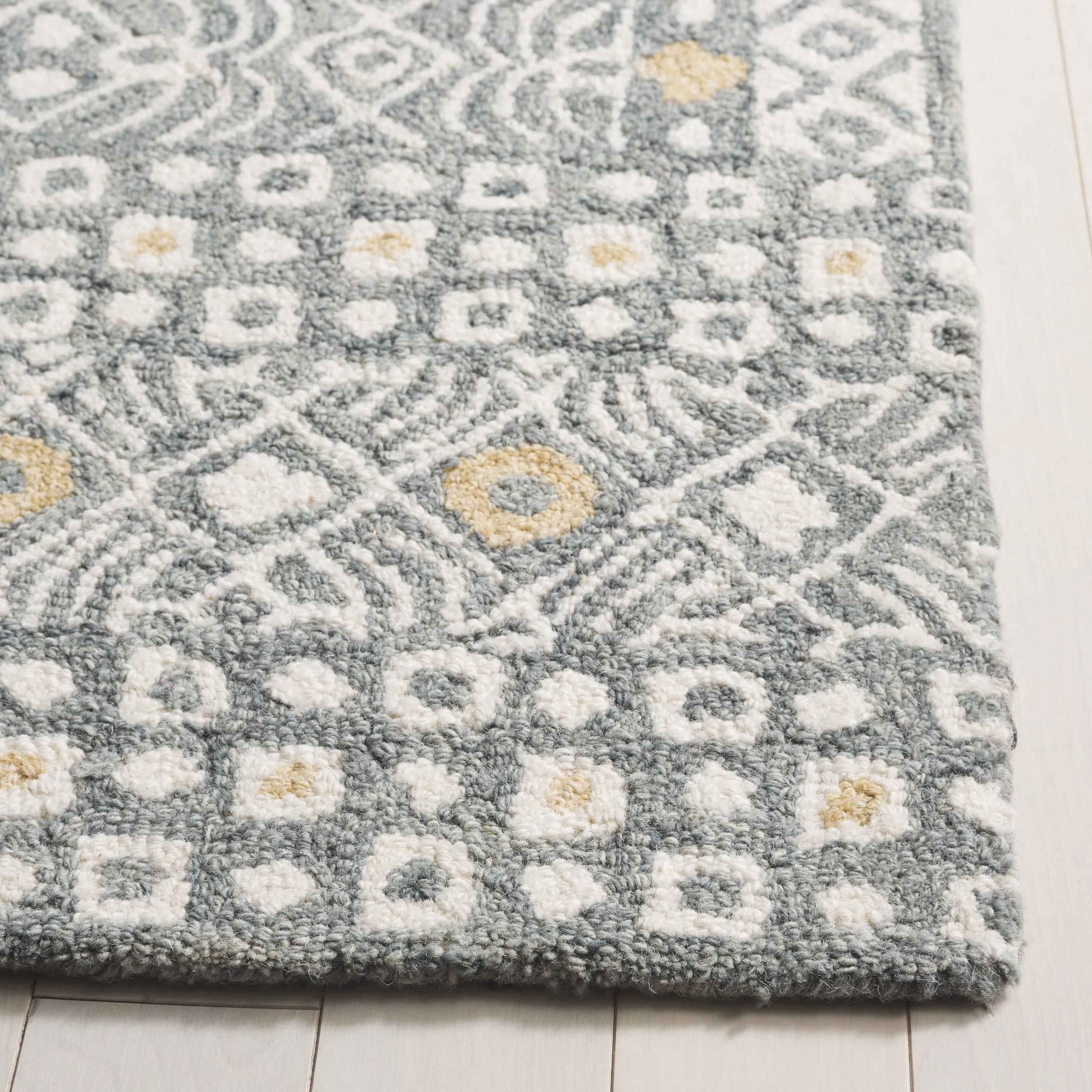 SAFAVIEH Handmade Micro-Loop Reglind Wool Rug