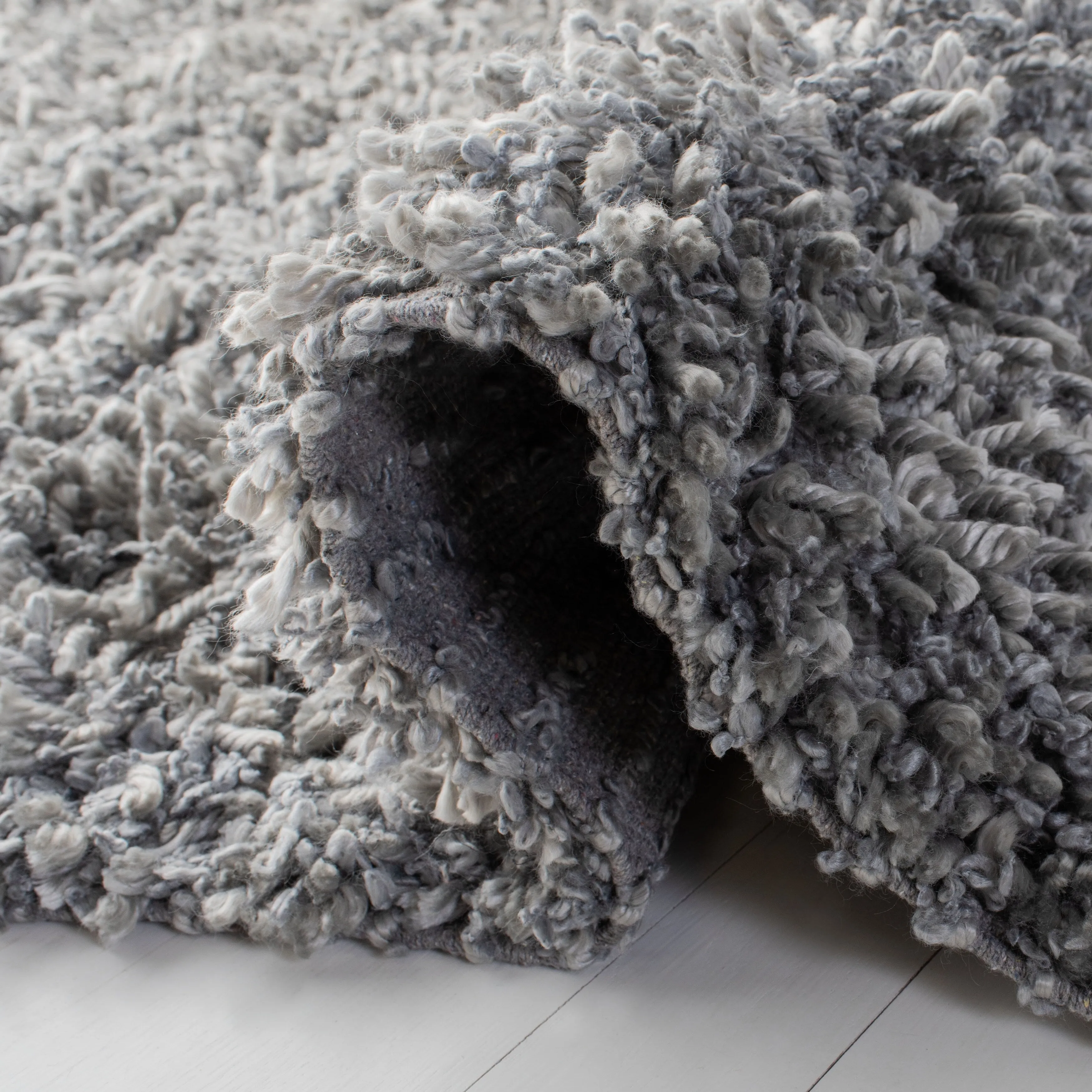 SAFAVIEH Handmade Sheep Shag Malti Solid Area Rug