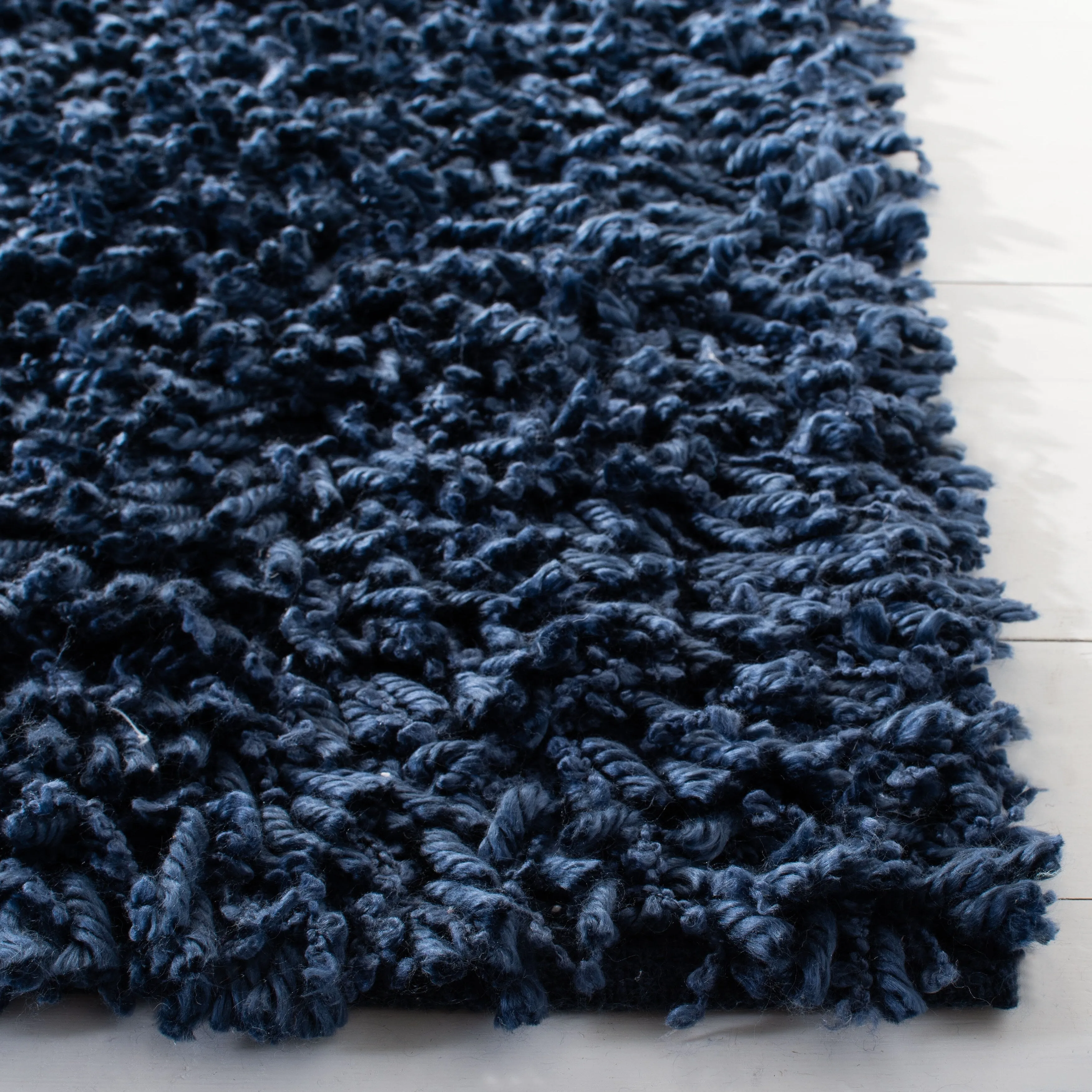 SAFAVIEH Handmade Sheep Shag Malti Solid Area Rug